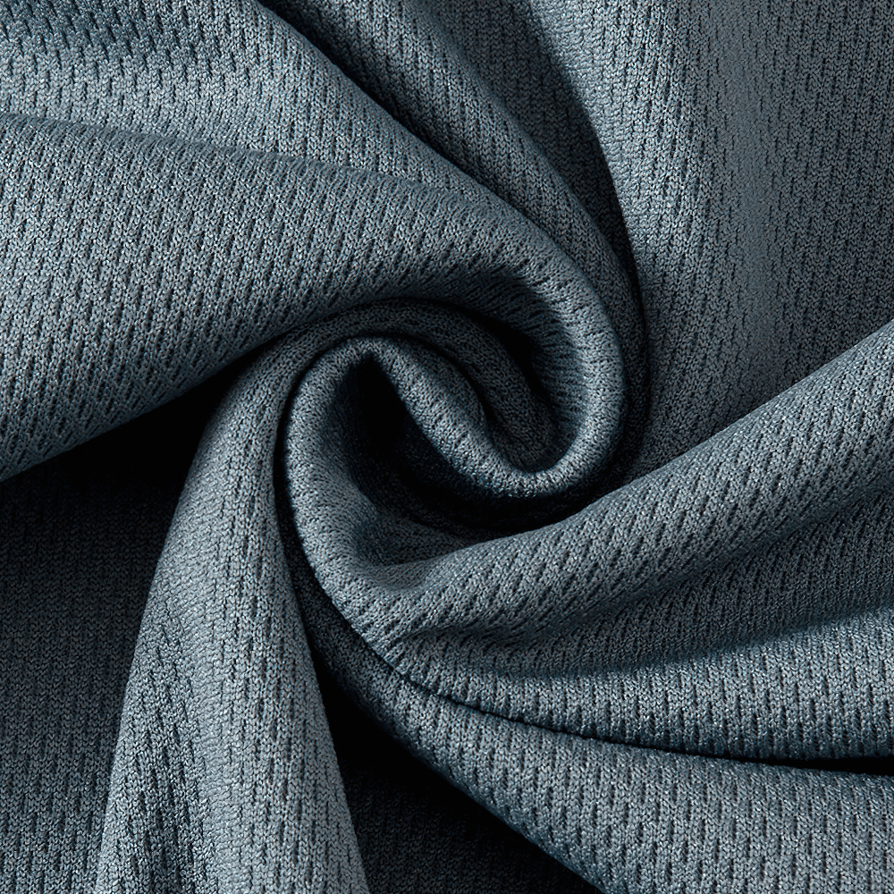 Close-up of blue quick-drying performance fabric with breathable texture, ideal for activewear and moisture-wicking clothing.